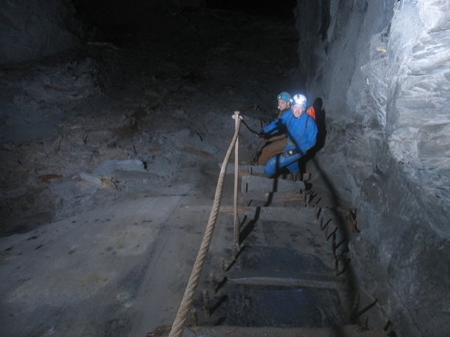 Climbing down the remains of a staircase