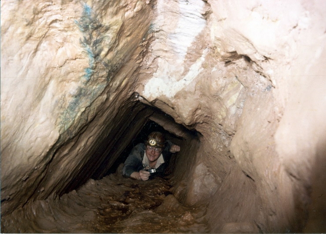 Crawling in top level of mine, close to the surface