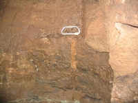 A small diameter shothole found and photographed at the end of the adit