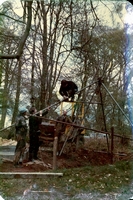 Putting the headframe in place. This dig preceded Bear Pit and a simple three-legged scaffolding frame was used.