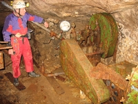 Pete looking over one of the pumps still in place in the mine from the 1950 period.