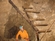 Steve looks up at a miners' improvised staircase.