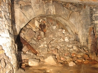 The end of the tunnel with a fine rustic stone arch