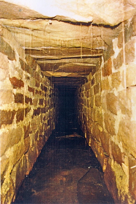 A simpler form of construction with stone walls and a stone slabbed roof.