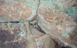 Triangular drill hole in ore viewed from above.
