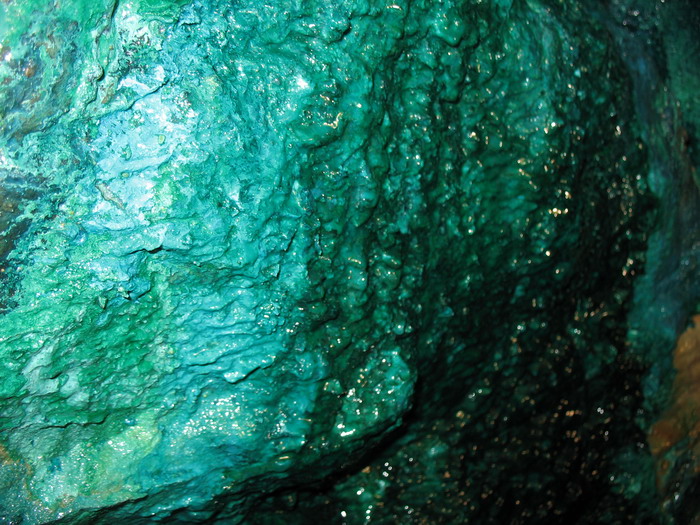 Chrysocolla on the surface of a wall in Wood Mine